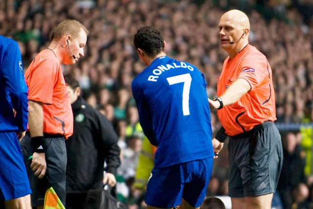 Manchester Utd's Cristiano Ronaldo (7) tries to get Scott Brown back to his feet during his first stint at Manchester United. SNS Group Craig Williamson.