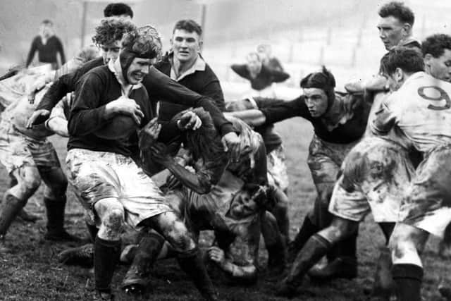 Scotland's Jim Greenwood (left) gets on the ball.