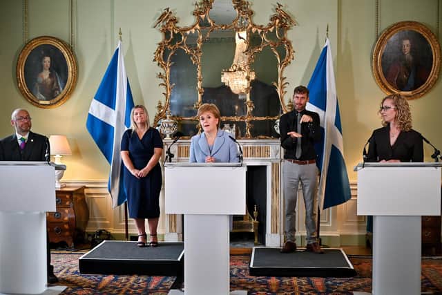 First Minister Nicola Sturgeon and Scottish Green Party co-leaders Patrick Harvie (left) and Lorna Slater (right) at Bute House, Edinburgh, after the finalisation of an agreement between the SNP and the Scottish Greens to share power in Scotland.