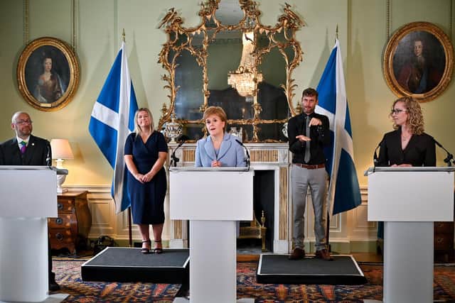First Minister Nicola Sturgeon and Scottish Green Party co-leaders Patrick Harvie (left) and Lorna Slater (right) at Bute House, Edinburgh, after the finalisation of an agreement between the SNP and the Scottish Greens to share power in Scotland.