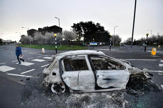 Burnt out cars can be seen at the Cloughfern roundabout junction following overnight Loyalist violence on April 4, 2021 in Belfast, Northern Ireland. Loyalist unrest and disorder in the province continues as a result of the implementation of the so called Irish sea border.