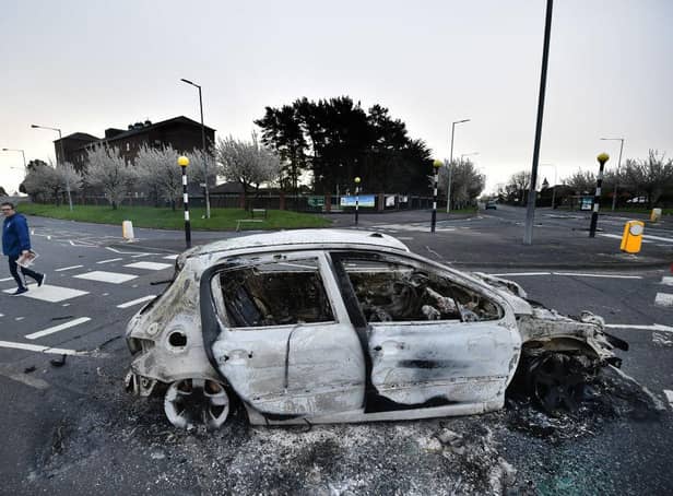 Burnt out cars can be seen at the Cloughfern roundabout junction following overnight Loyalist violence on April 4, 2021 in Belfast, Northern Ireland. Loyalist unrest and disorder in the province continues as a result of the implementation of the so called Irish sea border.