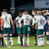 Hibs players surround referee David Munro at full-time after conceding an injury-time equaliser to Ross County. (Photo by Mark Scates / SNS Group)