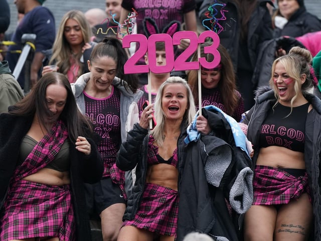 People take part in the Loony Dook New Year's Day dip in the Firth of Forth at South Queensferry