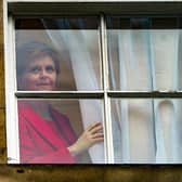 First Minister Nicola Sturgeon looks out from Bute House after announcing that she will stand down as first minister. Picture: Andrew Milligan/PA