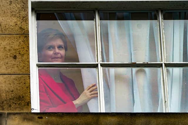 First Minister Nicola Sturgeon looks out from Bute House after announcing that she will stand down as first minister. Picture: Andrew Milligan/PA