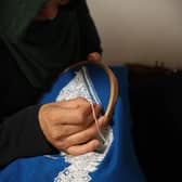 Ferhana, working in her clothes shop in Kabul.