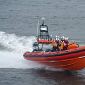 The crew of a fishing boat have been rescued from a life raft after their vessel ran aground.