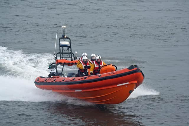 The crew of a fishing boat have been rescued from a life raft after their vessel ran aground.