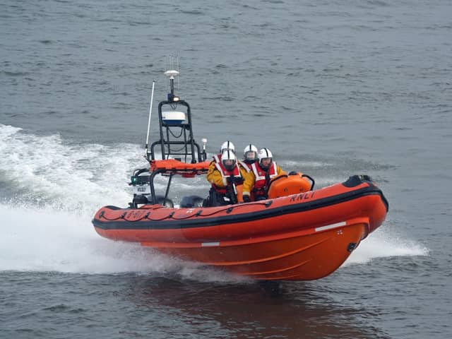 The crew of a fishing boat have been rescued from a life raft after their vessel ran aground.