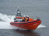 The crew of a fishing boat have been rescued from a life raft after their vessel ran aground.