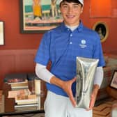 Gullane's Sam Mukherkee shows off the trophy after winning The Race to The Machie boys' event.