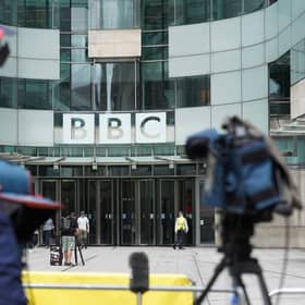 Members of the media report from outside BBC Broadcasting house, in central London, after a male presenter was suspended following allegations that he paid a teenager tens of thousands of pounds for sexually explicit images. Picture: Stefan Rousseau/PA Wire