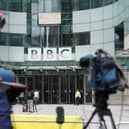 Members of the media report from outside BBC Broadcasting house, in central London, after a male presenter was suspended following allegations that he paid a teenager tens of thousands of pounds for sexually explicit images. Picture: Stefan Rousseau/PA Wire