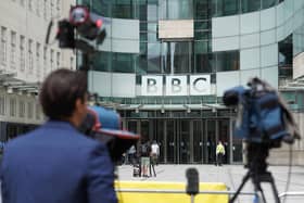 Members of the media report from outside BBC Broadcasting house, in central London, after a male presenter was suspended following allegations that he paid a teenager tens of thousands of pounds for sexually explicit images. Picture: Stefan Rousseau/PA Wire