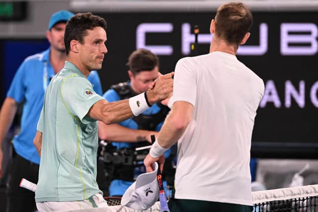 Roberto Bautista Agut and Murray shake hands at the end of the match.