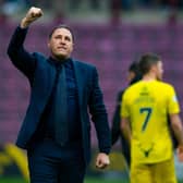 Ross County manager Malky Mackay salutes the travelling fans after a draw with Hearts.