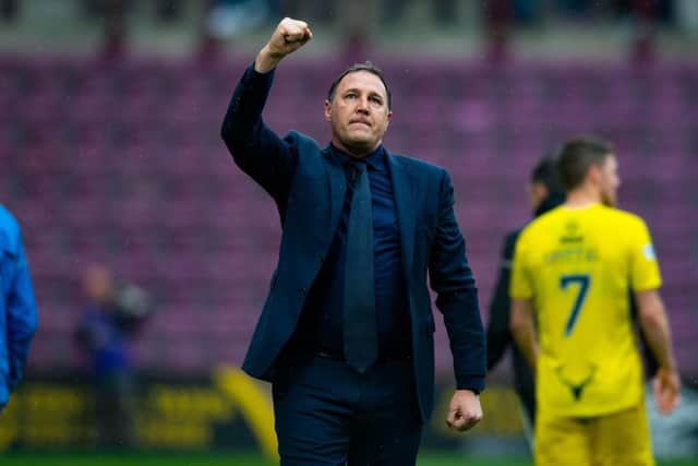Ross County manager Malky Mackay salutes the travelling fans after a draw with Hearts.