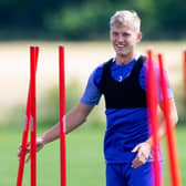 Hibs defender Josh Doig remains all smiles in training despite transfer distraction. Photo by Mark Scates / SNS Group