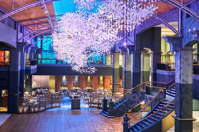 The impressive art installation is a focal point in the atrium and restaurants of the hotel.