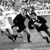 New Zealand's Wayne Smith (right) breaks away with the ball during the 25-25 draw with Scotland in 1983.