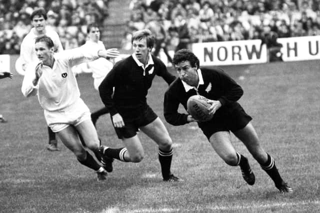 New Zealand's Wayne Smith (right) breaks away with the ball during the 25-25 draw with Scotland in 1983.