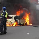 A car burns on Parliament Road, in Middlesbrough, during an anti-immigration riot. Credit: Owen Humphreys/PA Wire