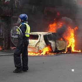 A car burns on Parliament Road, in Middlesbrough, during an anti-immigration riot. Credit: Owen Humphreys/PA Wire