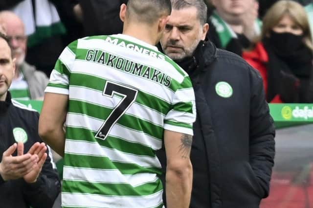 Celtic manager Giorgos Giakoumakis (L) speaks to manager Ange Postecoglou as he goes off with an injury during a cinch Premiership match between Celtic and St Johnstone at Celtic Park, on April 09, 2022, in Glasgow, Scotland. (Photo by Rob Casey / SNS Group)