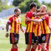 Partick's Brian Graham, left, celebrates making it 1-1 with Zak Rudden.