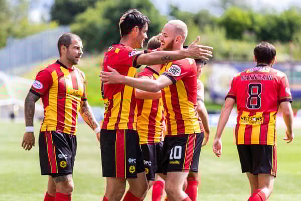 Partick's Brian Graham, left, celebrates making it 1-1 with Zak Rudden.