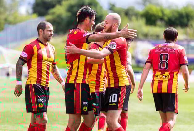 Partick's Brian Graham, left, celebrates making it 1-1 with Zak Rudden.