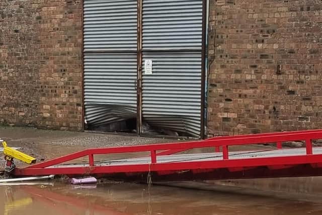 The force of the flood water in Brechin bent four agriculture doors, which are made with steel, at a potato merchant site in Brechin (pic: Willie Reekie)