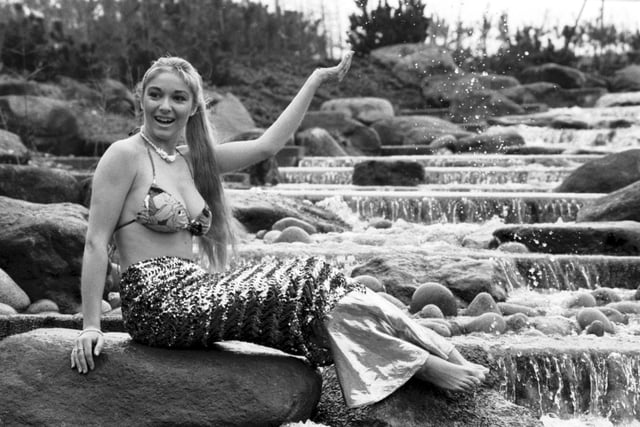 Former Miss Scotland Natalie Devlin dressed as a mermaid beside the OCS-sponsored waterfall at the Glasgow Garden festival site in March 1988.