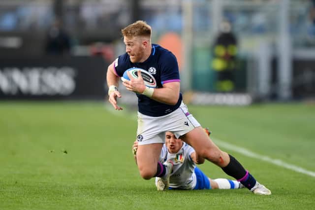 Kyle Steyn is tackled by Ange Capuozzo of Italy. (Photo by Justin Setterfield/Getty Images)