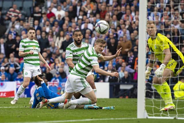Carl Starfelt directs the ball into his own net under pressure from Fashion Sakala as Rangers take a 2-1 lead over Celtic in extra-time. (Photo by Ross MacDonald / SNS Group)