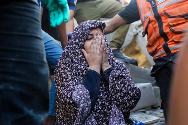 People search buildings destroyed in Israeli air raids in the southern Gaza Strip (Picture: Ahmad Hasaballah/Getty Images)