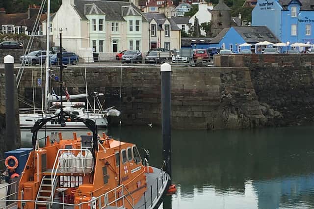 The harbour at Portpatrick is busy with boats and surrounded by colourful houses, making it a haven for artists.