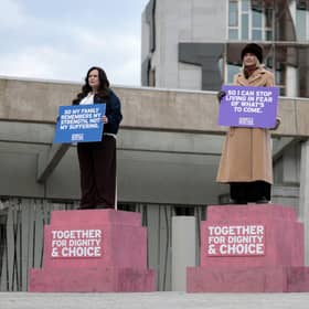 Terminally ill women Lisa Fleming, Tish McEwan and Lorna Weir stage an installation as 'living statues' outside the Scottish Parliament to show their support for the Assisted Dying Bill  (Picture: Jeff J Mitchell/Getty Images)