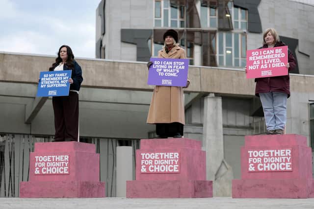Terminally ill women Lisa Fleming, Tish McEwan and Lorna Weir stage an installation as 'living statues' outside the Scottish Parliament to show their support for the Assisted Dying Bill  (Picture: Jeff J Mitchell/Getty Images)