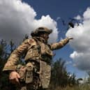 A Ukrainian drone operator from the 3rd Assault brigade lands his drone after a surveillance flight near Bakhmut in the Donetsk Region of Ukraine.