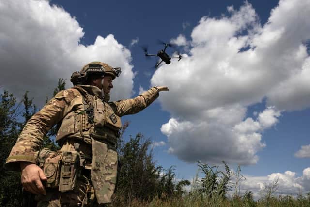 A Ukrainian drone operator from the 3rd Assault brigade lands his drone after a surveillance flight near Bakhmut in the Donetsk Region of Ukraine.