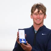 Calum Scott shows off the Silver Medal after finishing as the leading amateur in the 152nd Open at Royal Troon. Picture: Andrew Redington/Getty Images.