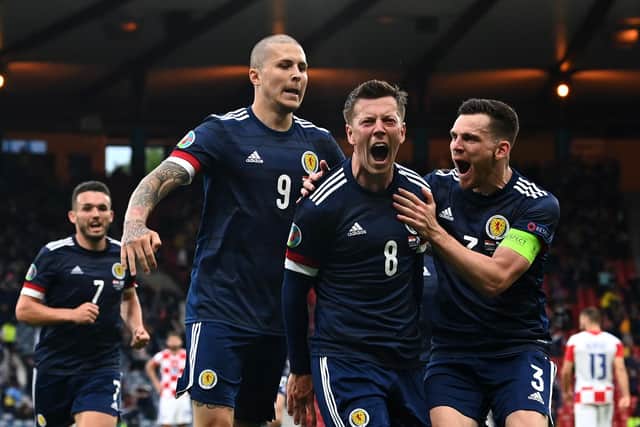 Callum McGregor celebrates with team-mates Lyndon Dykes and Andy Robertson after scoring against Croatia at Hampden on June 22, 2021. (Photo by Paul Ellis - Pool/Getty Images)