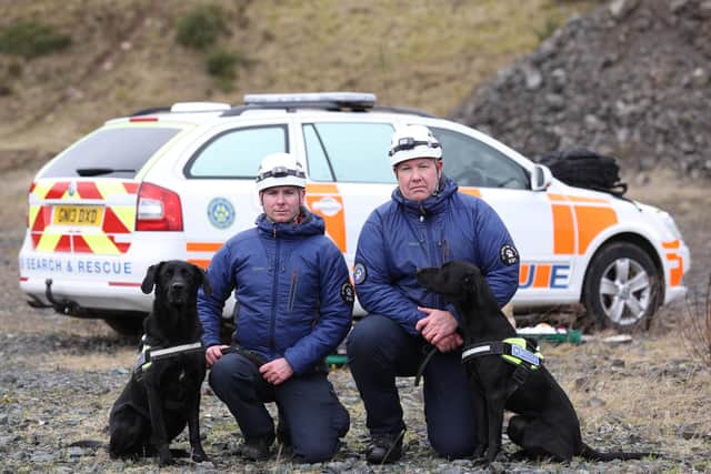 K9 Search and Rescue NI team leader, Ryan Gray (left) and deputy team leader, Kyle Murray with dogs Max (left) and Delta at the Wolf Hill quarry, Belfast. Members of the dog search and rescue charity will be travelling from Northern Ireland to Turkey to assist with search efforts following the devastating earthquakes in Turkey and Syria.