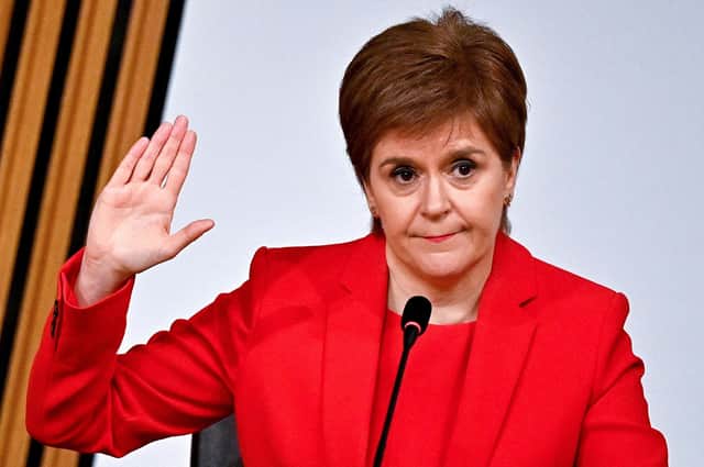 Nicola Sturgeon is sworn in before giving evidence to the Holyrood Committee on the Scottish Government Handling of Harassment Complaints (Picture: Jeff J Mitchell/pool/AFP via Getty Images)