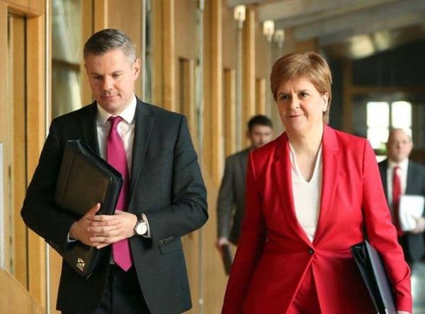 Former transport minister, Derek Mackay, and the First Minister, Nicola Sturgeon.