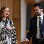 Humza Yousaf and Mairi McAllan, Net-Zero Secretary, share a light-hearted moment at Holyrood (Picture: Jeff J Mitchell/Getty Images)