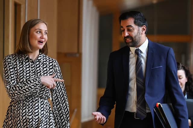 Humza Yousaf and Mairi McAllan, Net-Zero Secretary, share a light-hearted moment at Holyrood (Picture: Jeff J Mitchell/Getty Images)