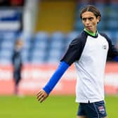 Ross County's Yan Dhanda warms up ahead of kick-off against Hibs on Saturday. (Photo by Ross Parker / SNS Group)